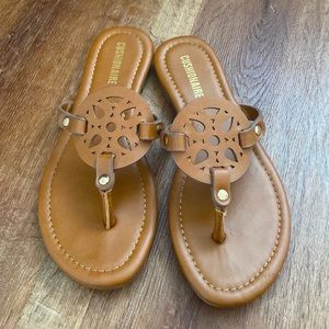 Dark tan flip flops